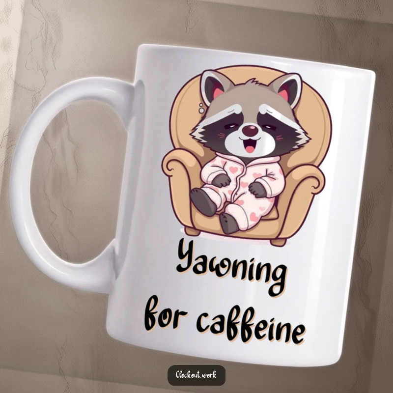 Funny mug featuring a sleepy raccoon wearing pajamas, happily yawning while relaxing in a cozy armchair.